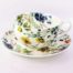 breakfast cup and saucer with meadow flowers, field poppy, kingcup, columbine and yellow rattle