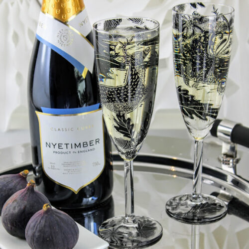Nyetimber English sparkling wine champagne flutes of deer in a woodland glade