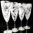 4 champagne glasses. sea theme frosted design with mofifs of octopus. starfish. coral. shell fish. and crabs