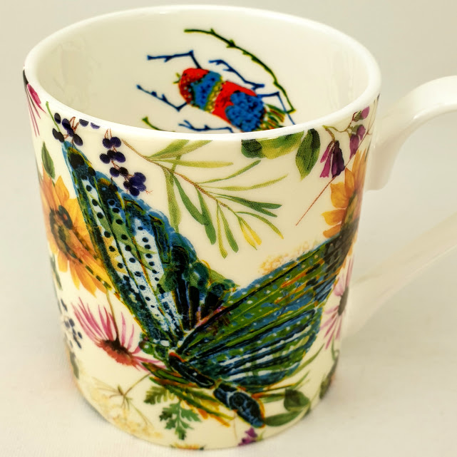 Ceramic mug insects in a meadow emerald moth and beetle